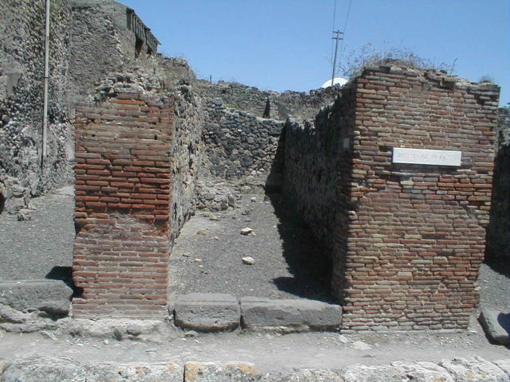IX.3.8 Pompeii. May 2005. Entrance. According to Della Corte, found on the pilaster on the right, between IX.3.8 and IX.3.9 was the graffiti
Multum  pistores  rogant     [CIL IV 886]  
This graffiti was written in support of the candidate Giulio Polibio, and Della Corte thought  it was a collective recommendation by the two bakeries on either side of the street.
See Della Corte, M., 1965.  Case ed Abitanti di Pompei. Napoli: Fausto Fiorentino. (p. 159)
Also found on this pilaster was a mutilated graffiti 
Titus ? �  rog(at)     [CIL IV 884]
See Della Corte, M., 1965.  Case ed Abitanti di Pompei. Napoli: Fausto Fiorentino. (p.162)
