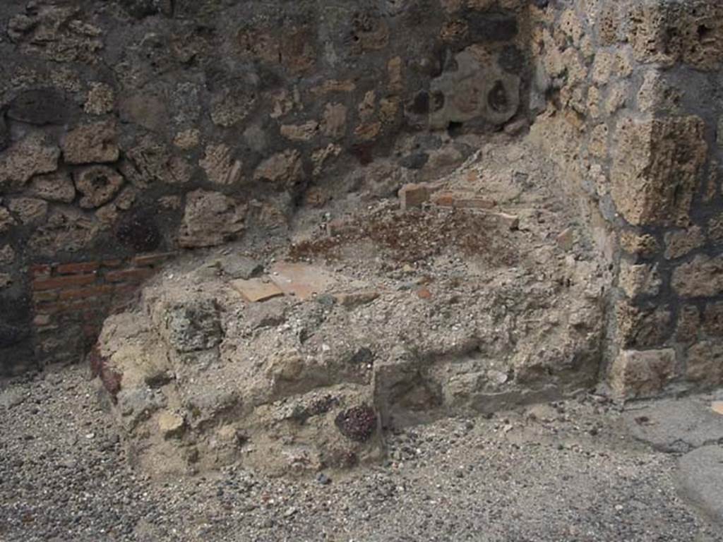 IX.3.10 Pompeii. May 2003. Masonry remains on north side of doorway linking shop to bakery. Photo courtesy of Nicolas Monteix.
