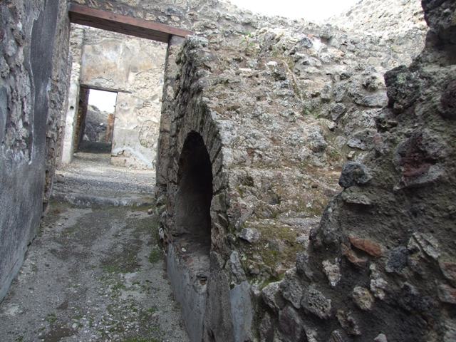 IX.3.15 Pompeii. March 2009. Latrine on right hand side, at end of entrance corridor.