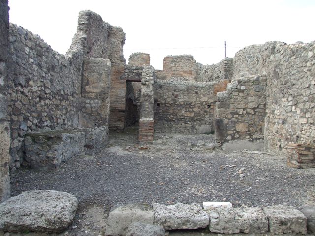 IX.3.17  Pompeii.  March 2009.   West side of workshop.    Remains of bench with water basin.
