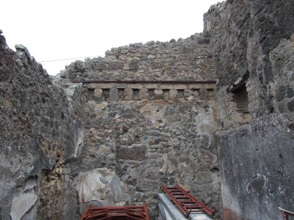IX.3.19 Pompeii. December 2007. Room 13, north wall with holes for the support beams for the upper floor.