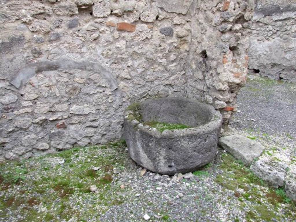 IX.3.20. Bakery. December 2007. Room 5. Remains of Tufa basin in doorway to room 6.
