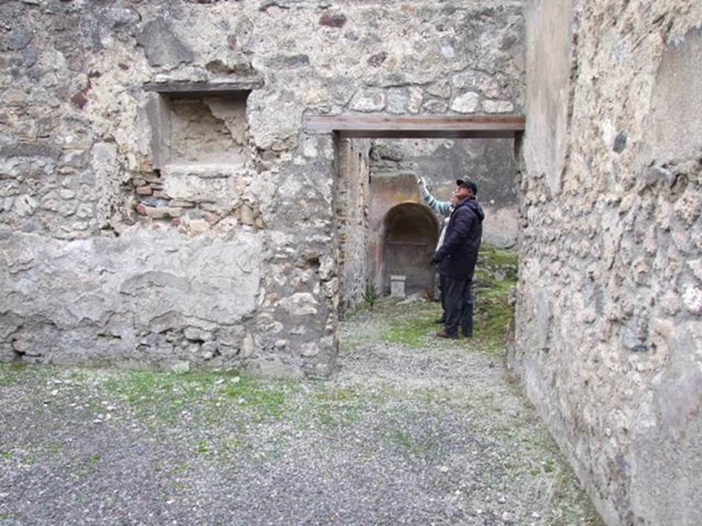 IX.3.20. Bakery. December 2007. Room 6. Niche on west wall and door into room 8.