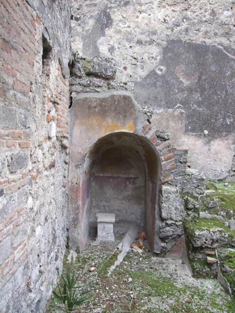 IX.3.20. Bakery. December 2007. Room 8. Garden area and staircase, with altar and water feature in arched recess.