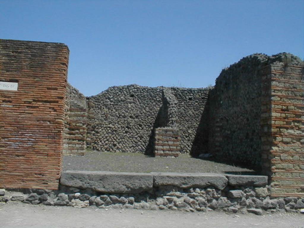 IX.4.1 Pompeii. May 2005. Entrance, looking east from Via Stabiana, towards rear rooms. 
According to Maiuri, three of the shops on the corner of this insula, appear to have had an elevated threshold of at least 0.80m above the floor of the sidewalk and what should have been the original threshold. They clearly distinguish the brickwork/masonry of the above elevation from the original floor of the threshold. In the third taberna (from the corner of the quadrivium) IX.4.3, only one block of the threshold appears located in its place.
See Maiuri, A, (2002): L�ultima fase edilizia di Pompei, Arte Tipografica, Naples, (p.75, note 3).
. 