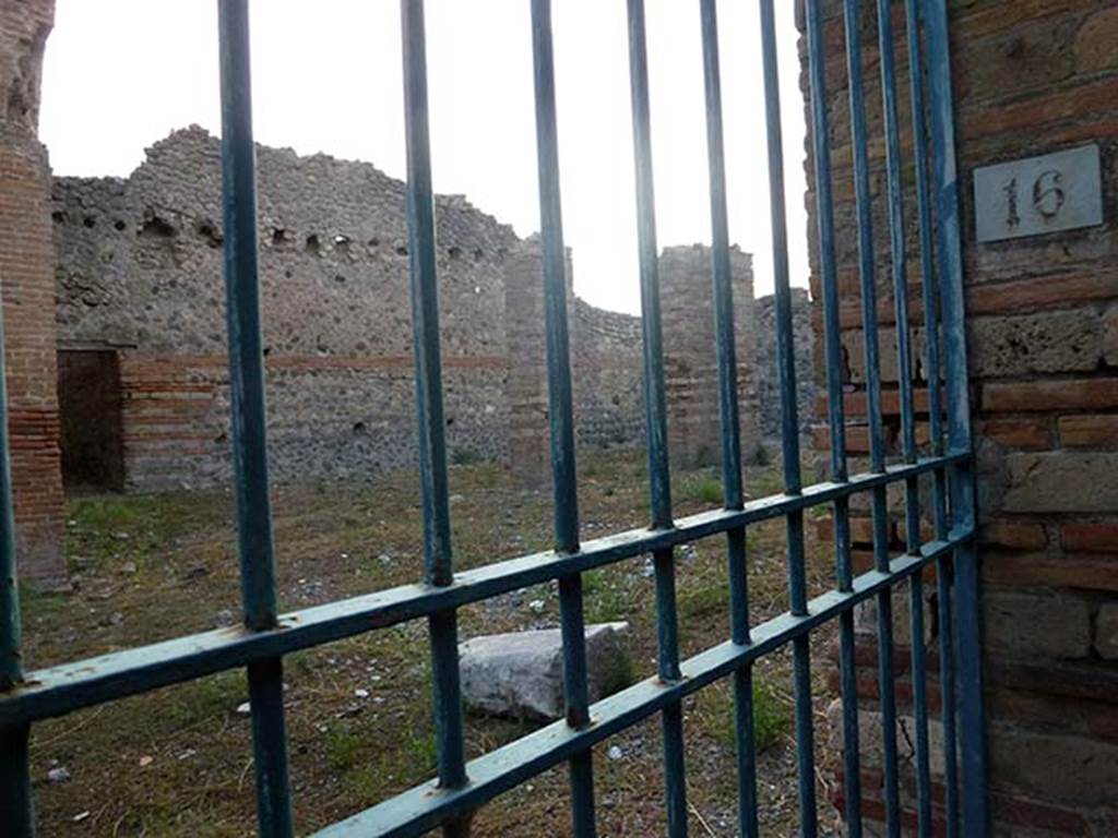 IX.4.16 Pompeii. September 2011. Open area “u” with three pilasters that may have been supports for a roof. The entrance to the corridor into apodyterium or vestibule “i” can be seen in the wall at the rear. Photo courtesy of Michael Binns.