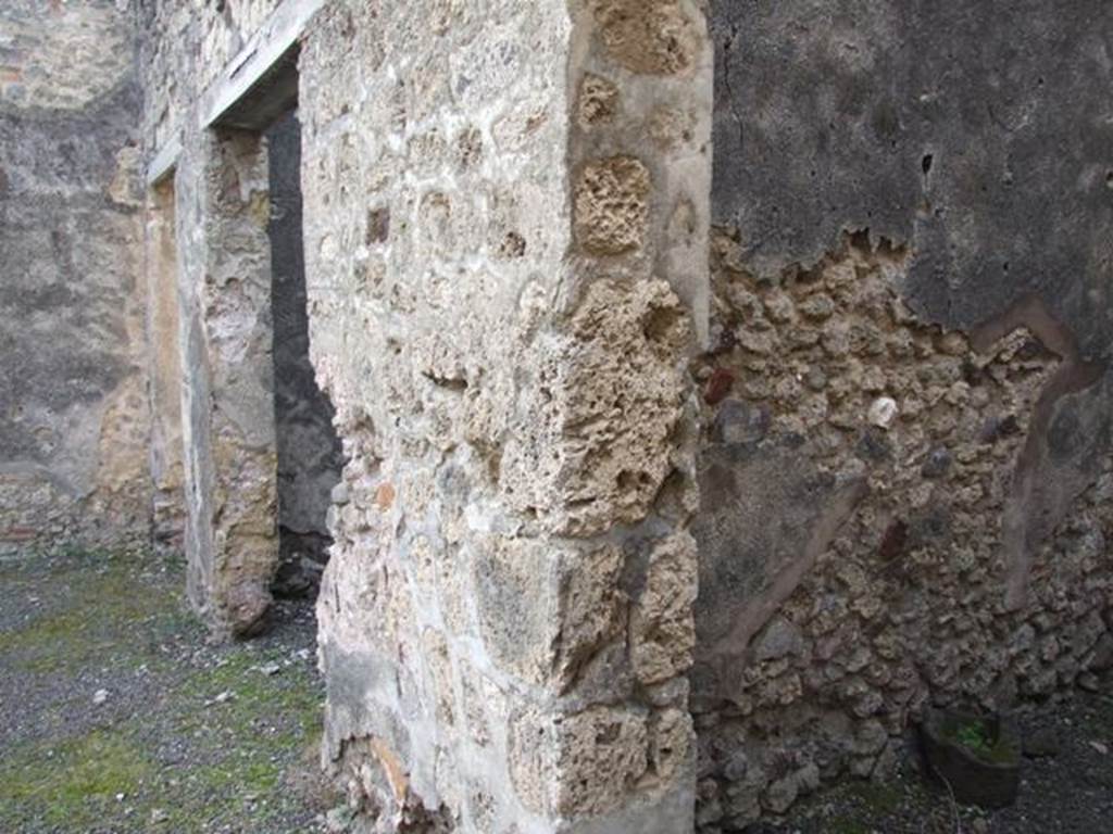 IX.5.2 Pompeii. December 2007. 
Looking south to doorways to rooms �q� and �r� on west side of peristyle, and corridor leading to IX.5.22 the rear entrance. 
According to Boyce, in the west wall of a room on the upper floor, above the first room on the west side of the peristyle, was a rectangular niche.
See Boyce G. K., 1937. Corpus of the Lararia of Pompeii. Rome: MAAR 14. (p. 85, no. 420) 
