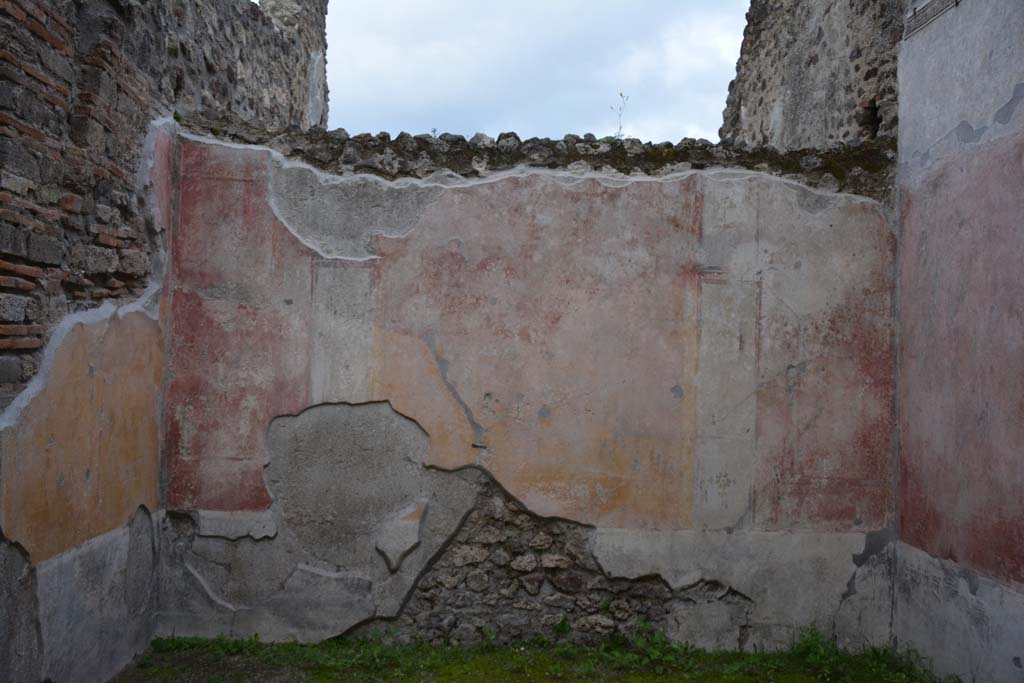 IX.5.9 Pompeii. March 2017. Room �p�, looking towards east wall.
Foto Christian Beck, ERC Grant 681269 D�COR.
According to PPM �
The east wall was decorated in IV style with panels with painted plants in a high black zoccolo, and in the middle zone, the central panel was yellow and the side panels were red, separated by architecture; the carpet borders on the side panels continued onto the nearby panels on the next wall in the manner to give the impression that large panels enclosed the entire room as a unit. 
See Carratelli, G. P., 1990-2003. Pompei: Pitture e Mosaici. IX (9). Roma: Istituto della enciclopedia italiana, (p.525).

