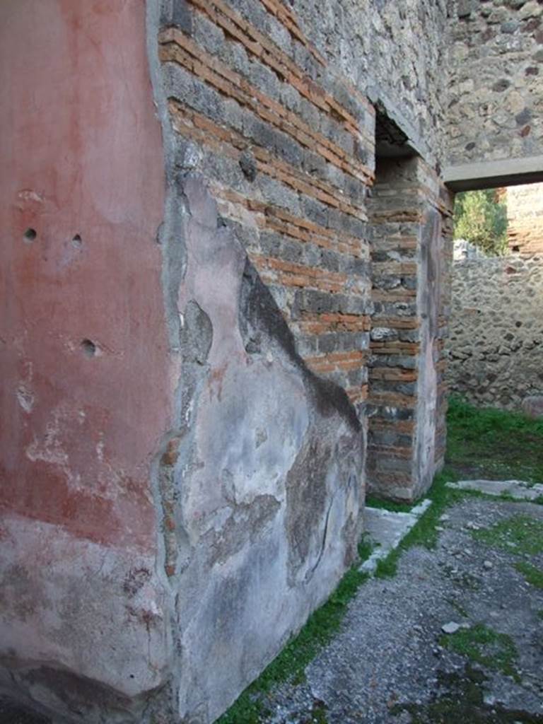 IX.5.11 Pompeii. December 2007. Looking north-west.
Room 8, north-east corner of ala and atrium wall, with doorways to rooms 9 and 10.
Mau thought that, almost certainly, on this pilaster facing onto the atrium would have been a personification of either autumn or winter, as was seen on the pilasters between rooms 3 and 4, and 7 and 8.  
See Bullettino dell�Instituto di Corrispondenza Archeologica (DAIR), 1879 (p.197).
