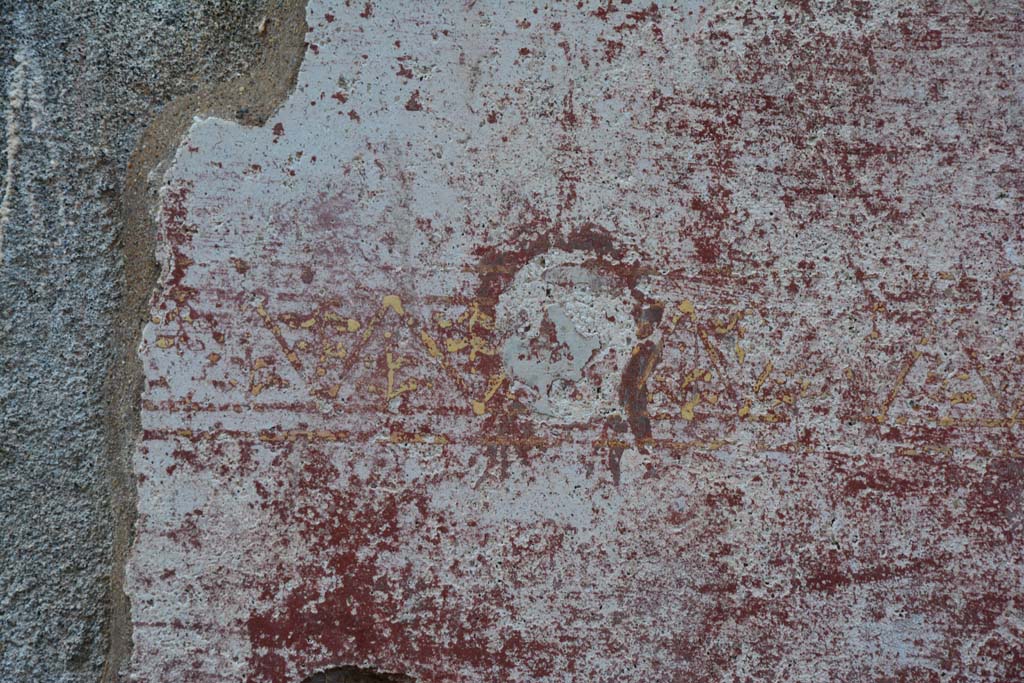 IX.5.11 Pompeii. March 2017. Room I (L), detail of painted mask from zoccolo at north end of east wall.
Foto Christian Beck, ERC Grant 681269 D�COR.

