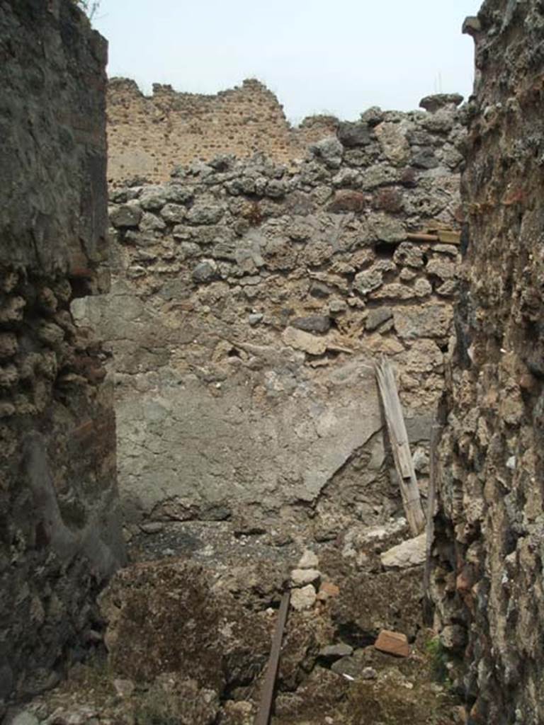 IX.5.14 Pompeii. May 2005.
Looking north across area of room “u”, stairs to upper floor, between rooms “r” and “q”.