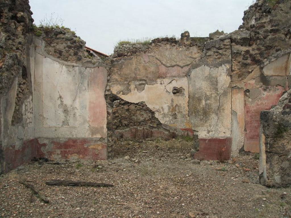 IX.5.18 Pompeii. May 2005. Room l (L) antecamera, in foreground, with room o, oecus at the rear. On the right, would be the site of the steps to the upper floor in a narrow storeroom, behind which was an alcove, capable of holding a seat or a bed: the floor of the alcove was raised. The zoccolo was dark red, the middle zone was painted with white panels edged with black bands, at the centre of which were medallions, of which three remained; one with a head of a Satyr crowned with rushes and a Cupid at his shoulder; another with the head of Apollo; and the third with the head of Diana (Artemis). To the north was a spacious room, decorated with red, yellow and white, in the centre of which were two rounds showing groups of Cupid with Psyche.
See NdS 1878, (p.269)
See Sogliano, A., 1879. Le pitture murali campane scoverte negli anni 1867-79. Napoli: Giannini. p. 27 (no.104), p.28 (no.112), p.43 (no.184),
p.67 (no.395/6)