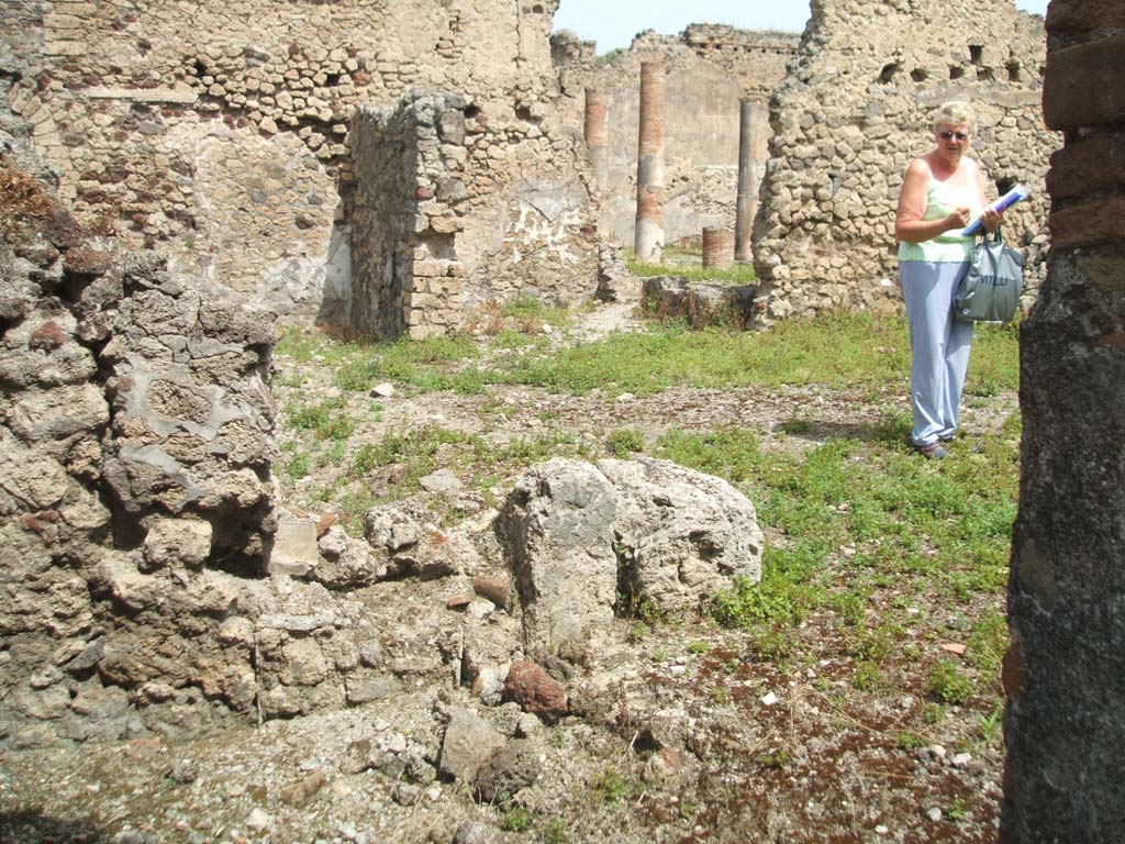 IX.6.4 Pompeii. May 2005. Looking north-east across site of garden courtyard and kitchen area, from small room “d” of IX.6.3.
The side and rear walls are missing between IX.6.3 and IX.6.4.
The lower left of the picture is the area of a small room d of IX.6.3.
Approximately behind this would have been the garden area of IX.6.4.
According to Boyce and Jashemski, there was an arched lararium niche in the south wall of the garden area.
Boyce said it was called “la piccolo nicchia dei Penati” by Notizie degli Scavi di Antichità, 1879, 20.
See Boyce G. K., 1937. Corpus of the Lararia of Pompeii. Rome: MAAR 14. (p.86, no.429)
See Jashemski, W. F., 1993. The Gardens of Pompeii, Volume II: Appendices. New York: Caratzas. (p.238).