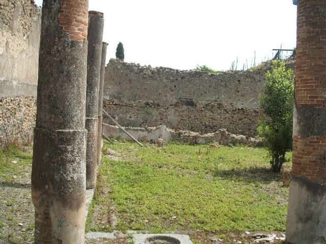 IX.6.5 Pompeii. May 2005. Peristyle garden area, looking south-east.
According to Jashemski, the portico around the peristyle was supported on four sides by 16 columns. They were painted black below, and white with reddish cast above. The columns on the east side were joined by a low wall.
See Jashemski, W. F., 1993. The Gardens of Pompeii, Volume II: Appendices. New York: Caratzas. (p.238)
