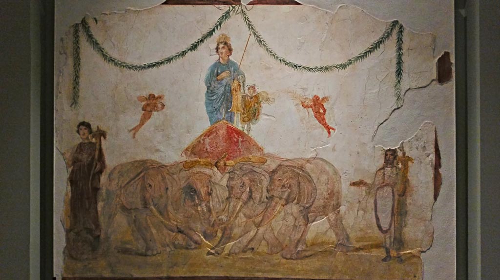 Between IX.7.7 and IX.7.6 Pompeii. December 2019.
Upper part of painting of Venus riding in a chariot pulled by elephants, from pilaster on east side of doorway.
On display in exhibition “Pompei e Santorini”, Rome, 2019. Photo courtesy of Giuseppe Ciaramella.