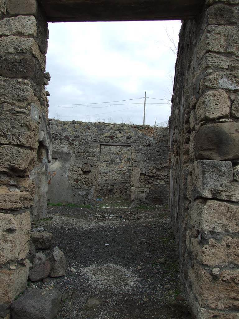 IX.7.19 Pompeii. December 2007. Looking east towards entrance doorway on Vicolo di Tesmo.
According to Mau, the threshold or doorsteps of both doorways, IX.7.19 and IX.7.18 were missing when excavated.
See Mau, Bullettino dell’Instituto di Corrispondenza Archeologica (DAIR), 1883, (p.78).