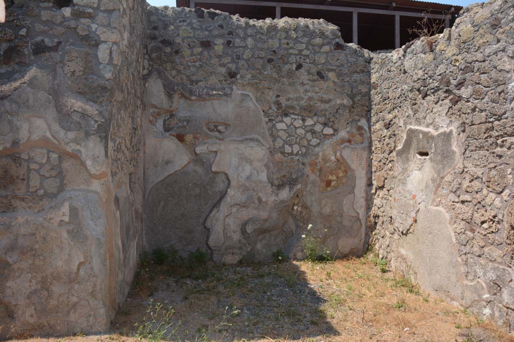 IX.7.19 Pompeii. July 2017. Looking north in ala c
Foto Annette Haug, ERC Grant 681269 DÉCOR.
According to Mau, when excavated the following paintings were found on the walls of this room.
Room c, the ala:
In the middle of the back (north) wall, - fish and shells in water (size: height 0.23m x length 0.31m - the right side was missing (half destroyed, according to Not. di Scavi, 1880, p.491).
On the sides of the back (north) wall – medallions enclosed in garlands (size: 0.20) –
on the left was the head of Diana crowned with leaves, with two javelins. She had dark hair with a narrow necklace around her neck and was wearing a red tunic buckled above both shoulders with a gold coloured buckle.
on the right was the head of Helios, with halo and blue rays, with a whip on the right shoulder. He had long blonde hair and was dressed the same as Diana.
On the right (east) wall, the remains of a destroyed lararium painting was found.
See Mau, in Bullettino dell’Instituto di Corrispondenza Archeologica (DAIR), 1883, (p.79).
See Sogliano, in Notizie degli Scavi di Antichità, 1880, (p.491).
According to Mau, when excavated the following paintings were found on the walls of this room.
Room c, the ala:
In the middle of the back (north) wall, - fish and shells in water (size: height 0.23m x length 0.31m - the right side was missing (half destroyed, according to Not.di Scavi, 1880, p.491).
On the sides of the back (north) wall – medallions enclosed in garlands (size: 0.20) –
on the left was the head of Diana crowned with leaves, with two javelins. She had dark hair with a narrow necklace around her neck and was wearing a red tunic buckled above both shoulders with a gold coloured buckle.
on the right was the head of Helios, with halo and blue rays, with a whip on the right shoulder. He had long blonde hair and was dressed the same as Diana.
On the right (east) wall, the remains of a destroyed lararium painting was found.
See Mau, in Bullettino dell’Instituto di Corrispondenza Archeologica (DAIR), 1883, (p.79).
See Sogliano, in Notizie degli Scavi di Antichità, 1880, (p.491).
According to Boyce, on the east wall of the left ala, a fragment of a lararium painting was seen at the time of excavation.
The fragment represented a single serpent moving amongst foliage.
See Boyce G. K., 1937. Corpus of the Lararia of Pompeii. Rome: MAAR 14. (p.88, no.437)
See Fröhlich, T., 1991. Lararien und Fassadenbilder in den Vesuvstädten. Mainz: von Zabern. (p.112)