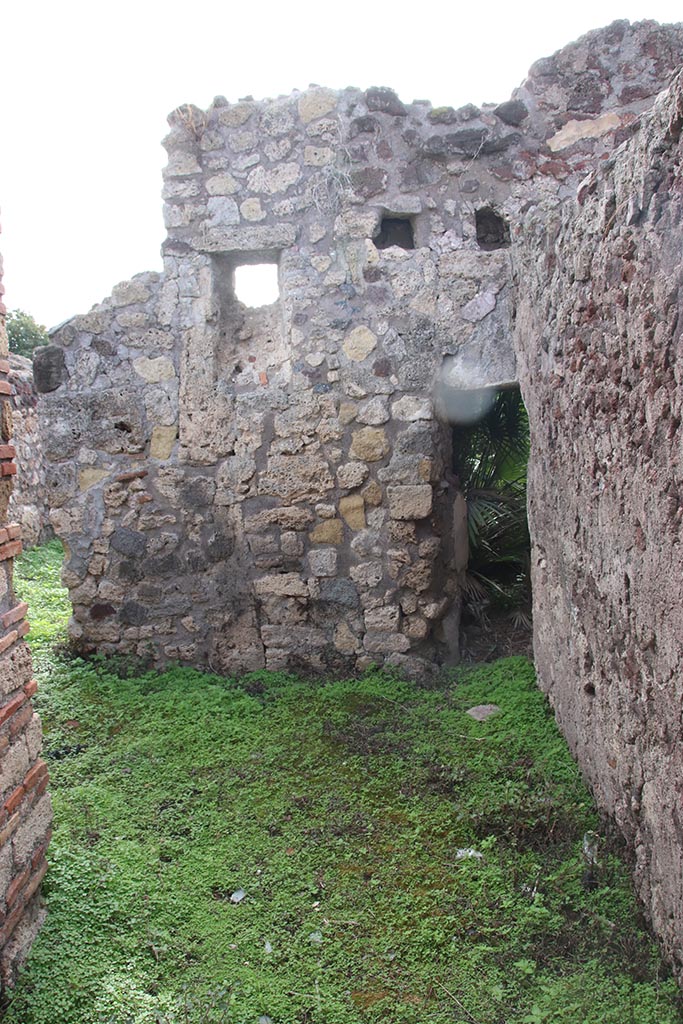 IX.7.19 Pompeii. October 2024. Corridor f.
Looking south towards narrow doorway to room i, kitchen and latrine. Photo courtesy of Klaus Heese.