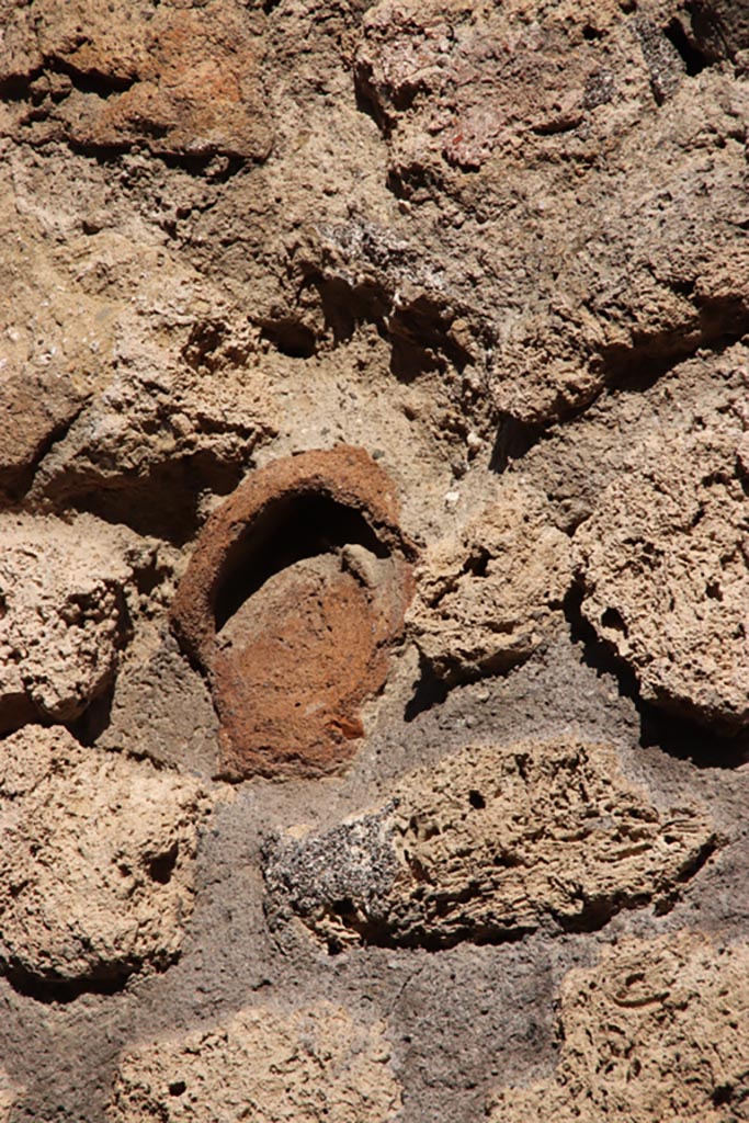 IX.7.21 Pompeii. Pompeii. October 2022.
Terracotta decoration embedded in wall. Photo courtesy of Klaus Heese.