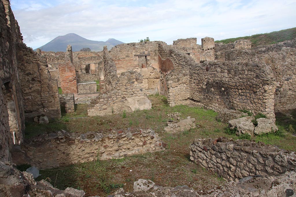 IX.7.21 Pompeii. October 2024.
Looking north across atrium from above room on south side of entrance doorway, which is on left. Photo courtesy of Klaus Heese.