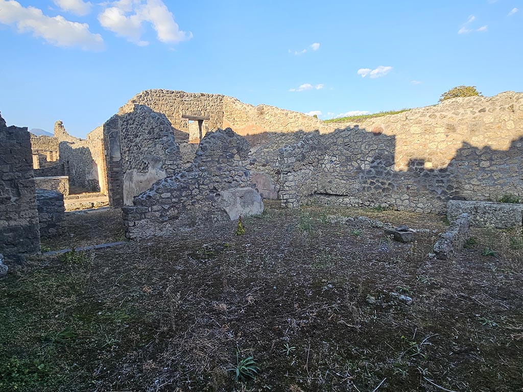 IX.7.21 Pompeii. November 2024.
Looking north-east across atrium, from entrance doorway, with doorway into IX.7.22, on left. Photo courtesy of Annette Haug.