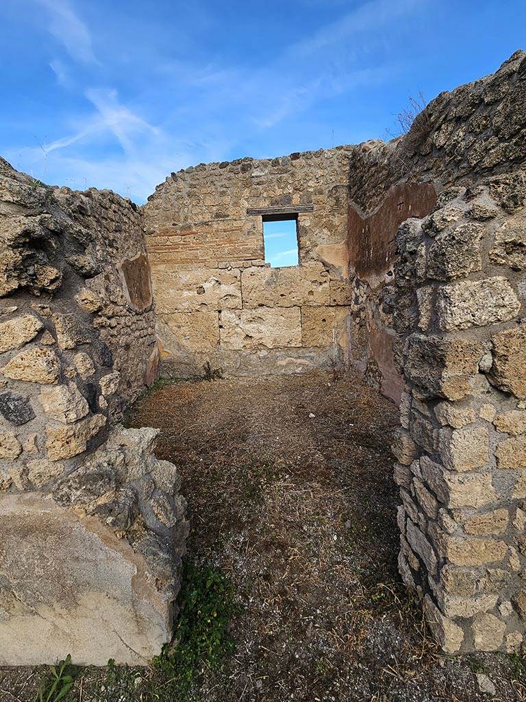 IX.7.21/22 Pompeii. November 2024.
Looking north through doorway in north-east corner of atrium. Photo courtesy of Annette Haug.