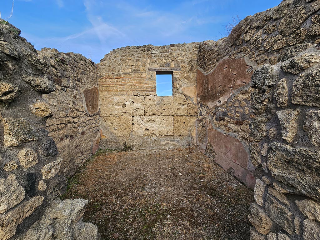 IX.7.21/22 Pompeii. November 2024.
Looking north through doorway in north-east corner of atrium towards west, north and east walls. Photo courtesy of Annette Haug.