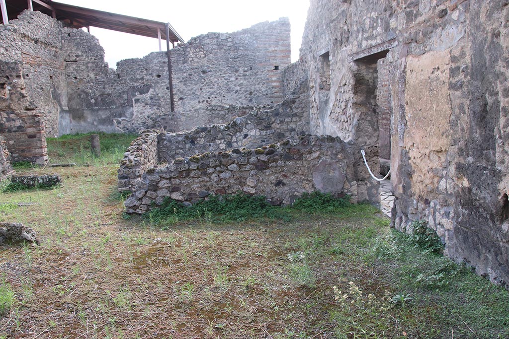IX.7.21 Pompeii. October 2024.
Looking south across west side of atrium, with entrance doorway, on right. Photo courtesy of Klaus Heese.