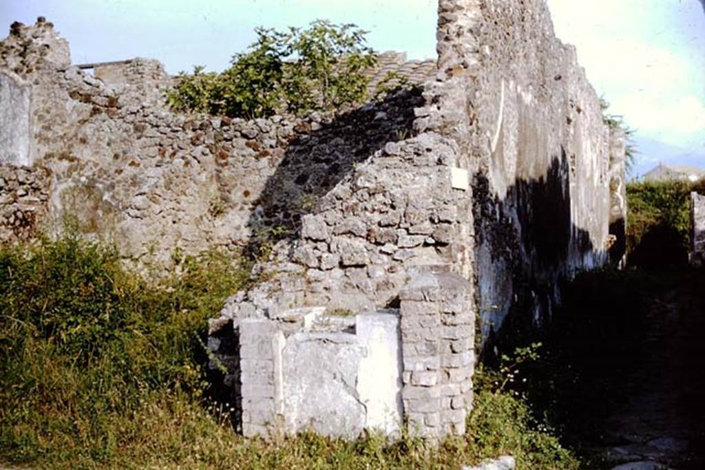 IX.8.1 Pompeii. 1964. 
North-west corner of insula, with street shrine, on west (right) side of entrance. Photo by Stanley A. Jashemski.
Source: The Wilhelmina and Stanley A. Jashemski archive in the University of Maryland Library, Special Collections (See collection page) and made available under the Creative Commons Attribution-Non Commercial License v.4. See Licence and use details.
J64f1252
