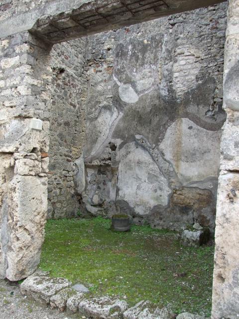 IX.8.7 Pompeii. March 2009.  Remains of base of stairs to upper floor, against south wall.