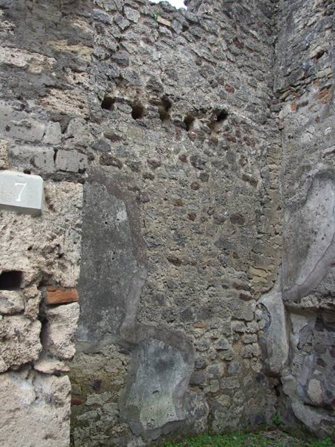 IX.8.7 Pompeii. March  2009.  Niche in south east corner, under line of stairs in rear wall.