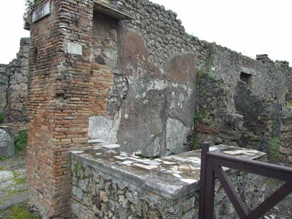 IX.9.8 Pompeii. May 2010. Looking south-east from Via di Nola towards the counter.  According to Cooley�s translation, CIL IV 3775 was found here, although she gives the location as IX.VII.8. According to the note in Jashemski, this address is given as IX.VII.8,  in Mau, RM (1889), p.30 and pl.1.  However Della Corte describes CIL IV 3775 as coming from the house �opposite the entrance� of the house of Aemilius Celer, which would be IX.8.8.  Neighbours beg you to elect Lucius Statius Receptus duumvir with judicial power, a worthy man. Aemilius Celer wrote this, a neighbour. You jealous one who destroys this, may you fall ill.
See Cooley, A. and M.G.L., 2004. Pompeii : A Sourcebook. London : Routledge. (p.126)
See Jashemski, W. F., 1993. The Gardens of Pompeii, Volume II: Appendices. New York: Caratzas. (p.247)
See Della Corte, M., 1965.  Case ed Abitanti di Pompei. Napoli: Fausto Fiorentino. (p.166)

