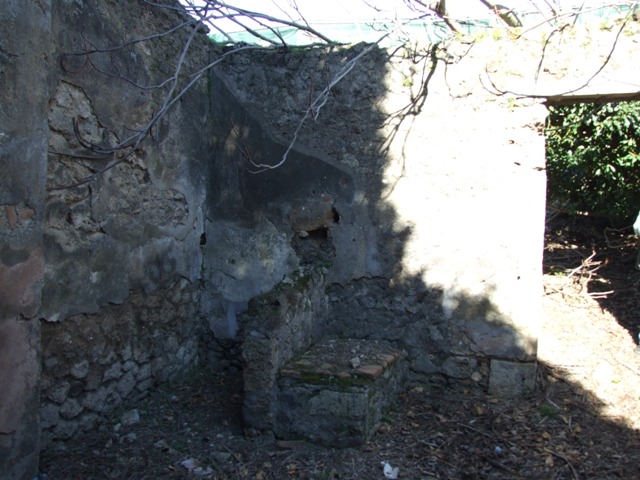 IX.9.11 Pompeii. March 2009. Room 2, south wall of cubiculum.
According to Boyce, this room housed an unusual sacellum. The south wall was coated with a poor white stucco, and in it were set three arched niches. A larger niche was in the centre, with a smaller one on either side. All were coated with white stucco. In the street wall was yet another niche, formed by bricking up a former window. Therefore the window was left without any windows. The recess in the south-east corner must date from when the room was a simple cubiculum. See Boyce G. K., 1937. Corpus of the Lararia of Pompeii. Rome: MAAR 14. (p.92, no.462) 
