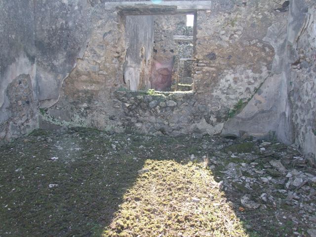 IX.9.12 Pompeii. March 2009. Looking east across room 11. Doorways to room 14 , entrance doorway (centre), and room 12.