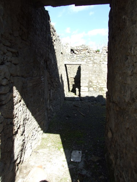 IX.9.f Pompeii.  March 2009.  Doorways on east side of atrium, to Staircase to upper floor, and Tablinum (or Triclinium?)
