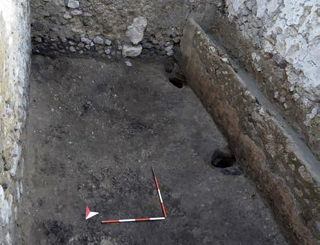 IX.10.1 Pompeii. December 2023. Room 9.
Stable room 9 is a rectangular-shaped space characterised along the western side by a masonry structure with a trough used as a manger.
The plain earthen floor in the area facing the manger revealed three post holes that must have supported a wooden structure, perhaps already disused at the time of the renovation site.
Photograph © Parco Archeologico di Pompei.
See Pompeii E-Journal 08, 08.12.2023, p. 88, fig. 5. Download: PAP e-journals 2023 collection volumes 01-09
