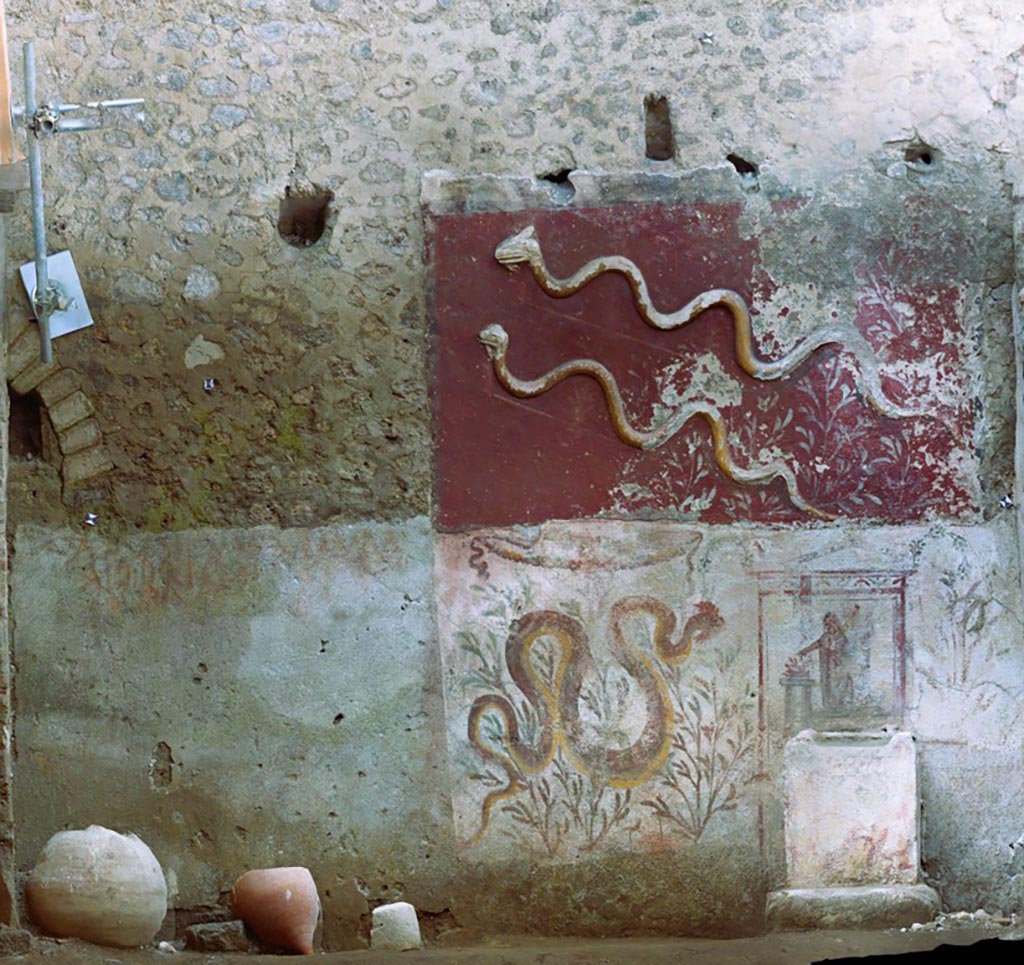 IX.10.1 Pompeii. September 2023. Lararium and altar recently found in room 12.
Photo of the south wall of the lararium (12).
The lararium is structured on two superimposed registers with an upper register decorated with stucco and a lower register decorated with frescoes.
Fotopiano della parete sud del larario (12).
La rappresentazione è strutturata su due registri sovrapposti con un registro superiore decorato a stucco ed uno inferiore decorato ad affresco.
See PAP e-journal 6, 28.09.2023, p. 64, fig. 10. Download: PAP e-journals 2023 collection volumes 01-09
Photograph © Parco Archeologico di Pompei.