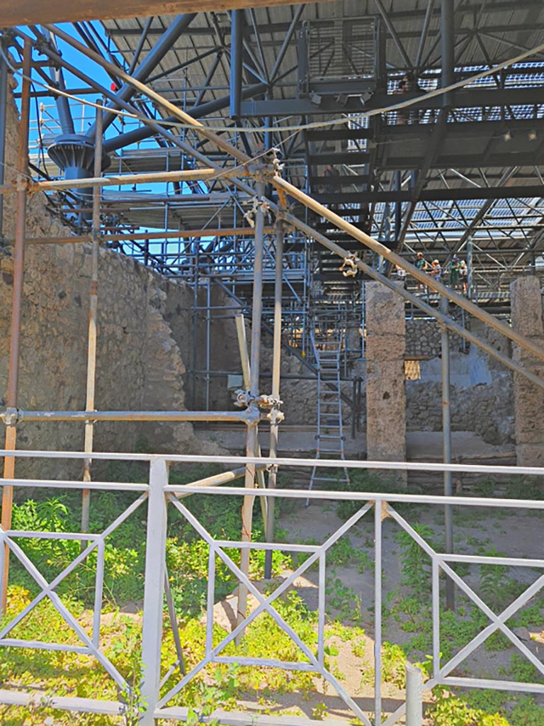 IX.12.1 Pompeii. June 2024.
Looking north through entrance doorway into room “a”, with rear rooms “b”, on left, and “c”, on right.
Photo courtesy of Giuseppe Ciaramella.