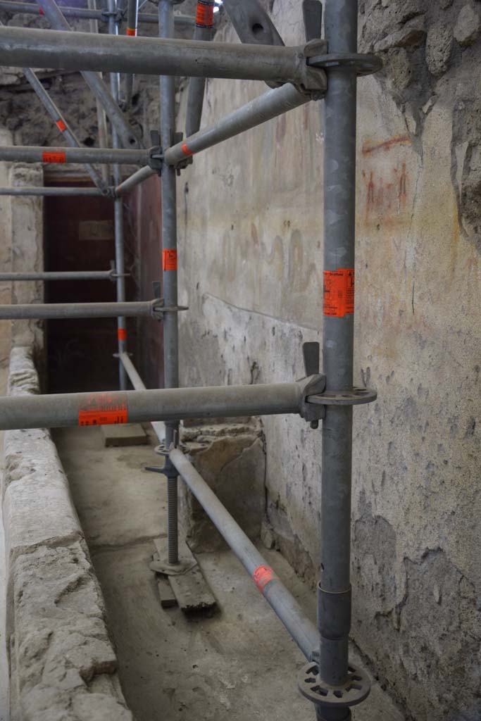 IX.12.6 Pompeii. February 2017. 
Room “n1”, looking south along west wall towards lararium with altar below. 
Photo courtesy of Johannes Eber.

