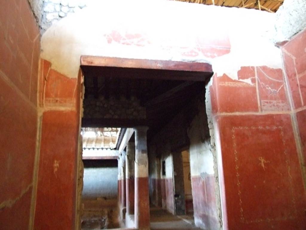IX.12.9 Pompeii. March 2009. Room 3, west wall of cubiculum, with doorway looking west across north portico 5b. 

.