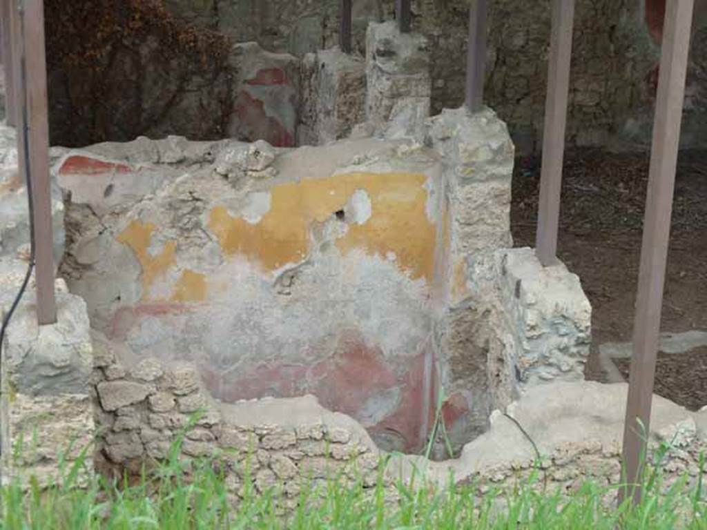 IX.14.c Pompeii. May 2010. Room 5, room on south side of entrance corridor. North wall. According to NdS, both rooms 4 and 5 had a similar wall decoration, low black plinth, red decorations and frieze of yellow. A square window was found high in the western wall. To the right of the south wall was a recess for the edge of a bed along the west wall. The flooring was of signinum with tesserae placed in lines forming a lozenge design. See Notizie degli Scavi di Antichit�, 1911, p. 375.