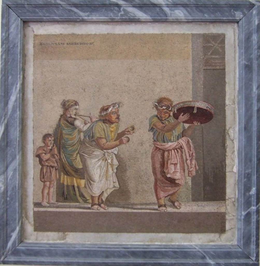 HGW06 Pompeii. Found on 8th April 1763. Ambiente 13 of Villa of Cicero. Mosaic of a Group of Street Musicians. It bears the signature of Dioskourides of Samos. Now in Naples Archaeological Museum. Inventory number 9985.