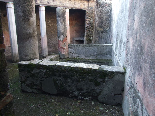 HGW24 Pompeii. December 2006. South-west side of small courtyard in baths complex. According to Mau, on the left is a doorway to the apodyterium, and in the centre is a doorway to a storeroom.
See Mau, A., 1907, translated by Kelsey, F. W., Pompeii: Its Life and Art. New York: Macmillan. (p. 356). According to Breton, the doorway on the left would have led to the frigidarium, and the doorway in the centre would have led to the apodyterium or changing room. See Breton, Ernest. 1870. Pompeia, Guide de visite a Pompei, 3rd ed. Paris, Guerin.