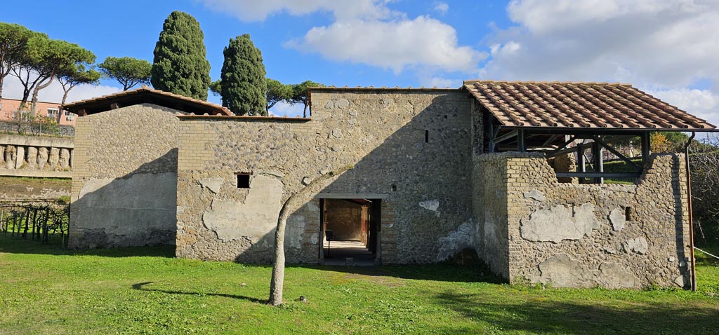 Villa Regina, Boscoreale. December 2023.
Looking towards entrance doorway XIV on south side of villa. Photo courtesy of Miriam Colomer.