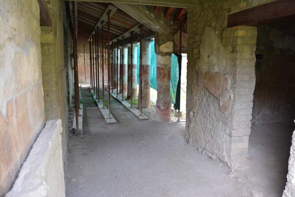 Villa Regina, Boscoreale. April 2017.
Looking north through entrance doorway XIV towards west side of portico VII, with doorway to room X, on right.
Photo courtesy of Adrian Hielscher.