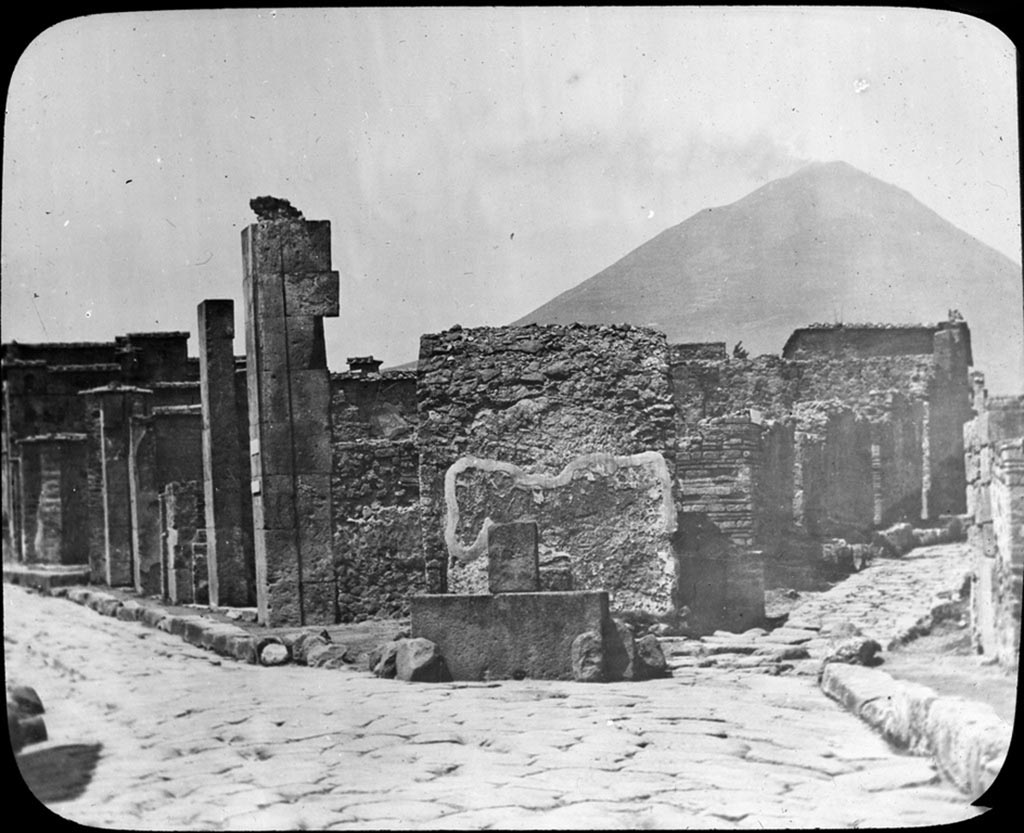 Via Consolare, on left. Photo by York and Son. Looking north to junction with Vicolo di Narciso, on right.
Used with the permission of the Institute of Archaeology, University of Oxford. File name instarchbx208im 010a. Source ID. 56370.
See photo on University of Oxford HEIR database