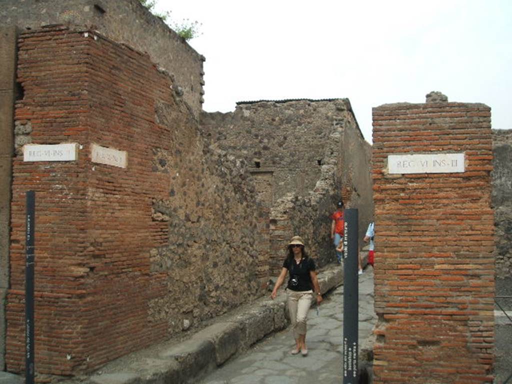 Via Consolare. Looking east into Vicolo di Mercurio, between VI.2 and VI.3. May 2005.