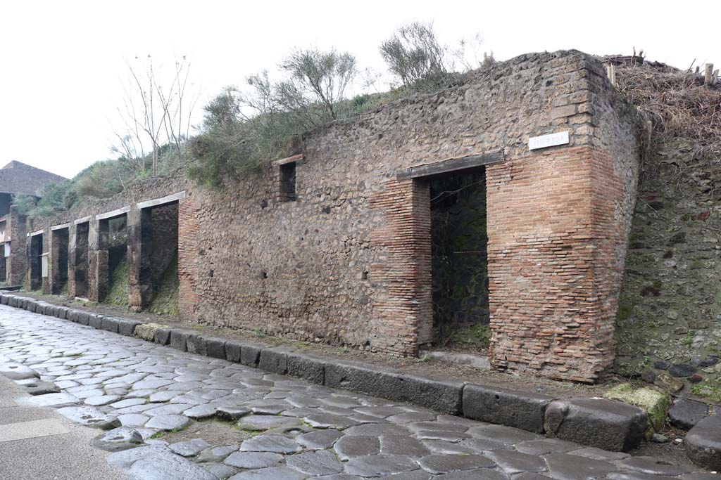 Via dell’Abbondanza, north side. December 2018. 
Looking west along insula from III.1.6, on right, towards III.1.1, on left. Photo courtesy of Aude Durand.
