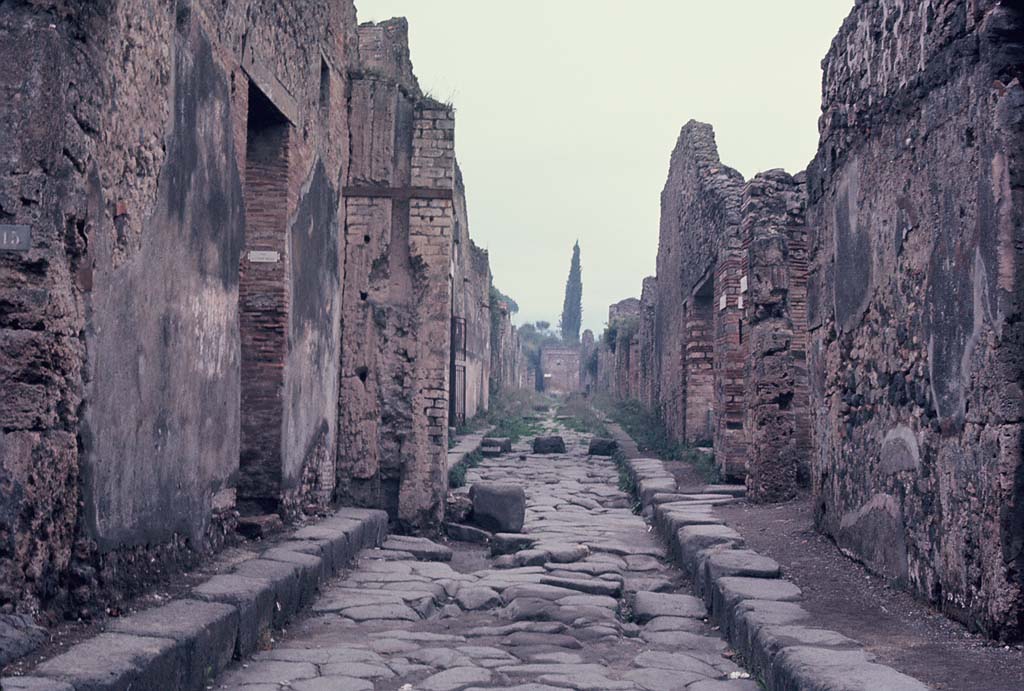 Vicolo dei Vettii, Pompeii. November 1966.
Looking north between VI.13.16 (on left) and VI.14.36 towards junction with Vicolo di Mercurio. Photo courtesy of Rick Bauer.