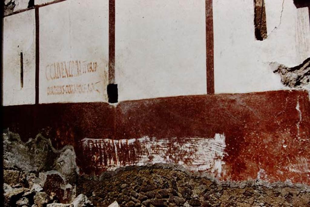 Vicolo di Ifigenia, east side, Pompeii. 1961. Exterior wall between entrances III.4.e, on left, and III.4.d, on right. Photo by Stanley A. Jashemski.
Source: The Wilhelmina and Stanley A. Jashemski archive in the University of Maryland Library, Special Collections (See collection page) and made available under the Creative Commons Attribution-Non Commercial License v.4. See Licence and use details.
J61f0555